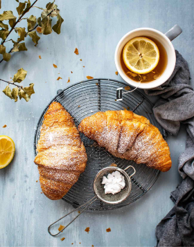 Tasty croissant and tea for perfect breakfast img 1 2